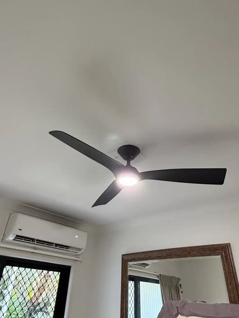 New ceiling fan with light installed in a Norman Park bedroom by a Brisbane southside electrician