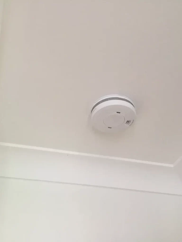 Old smoke alarm replaced with a new interconnectable unit in Corinda, Brisbane