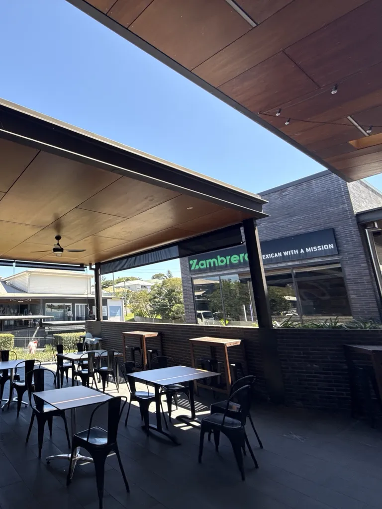 Festoon lights our electrician in Camp Hill hung across the ceiling of a cafe’s outdoor dining area