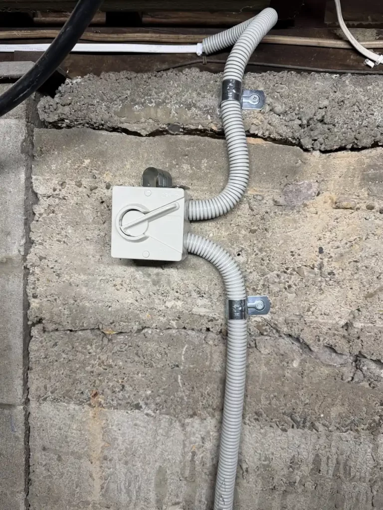New isolator and conduit for a dedicated hot water circuit under an Annerley house