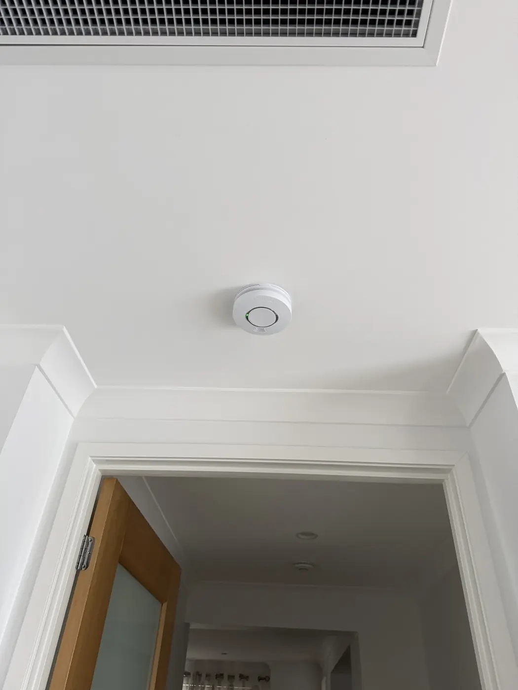 Interconnected smoke alarm installed in a hallway outside the bedrooms in Tarragindi, Brisbane