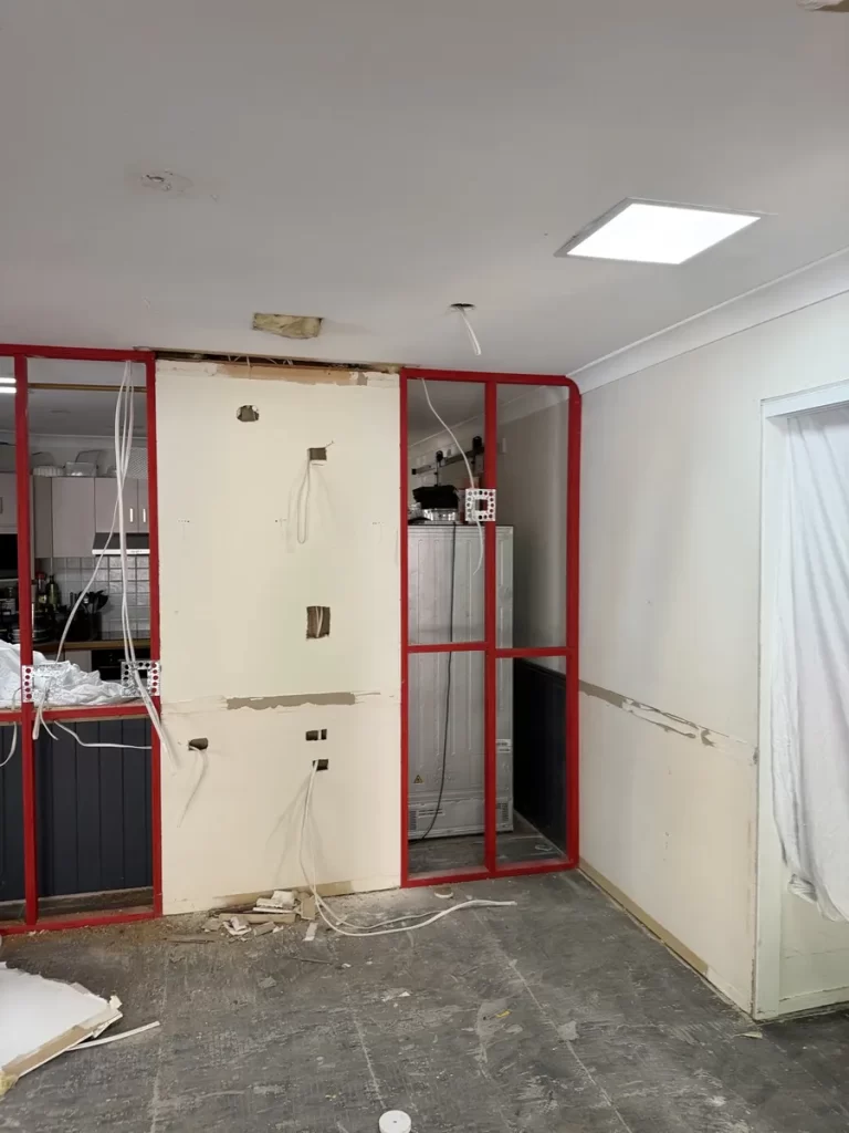 Kitchen renovation in Regents Park with the electrical rough in done and the frame open