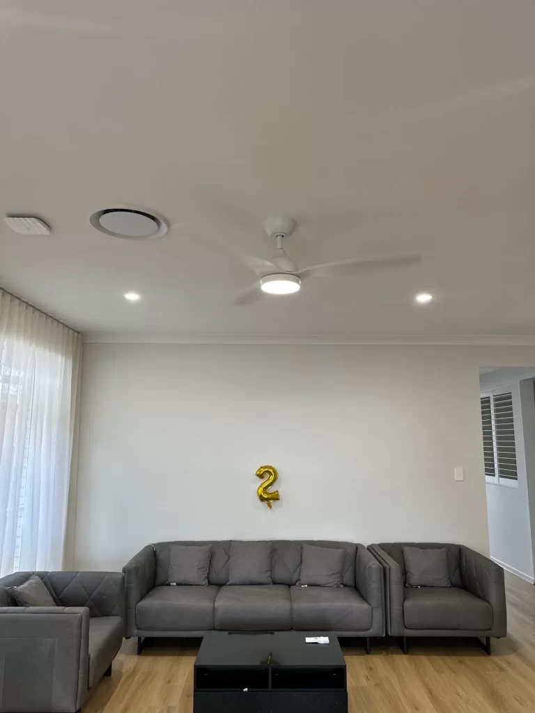 LED downlights and a ceiling fan in a Brisbane living room