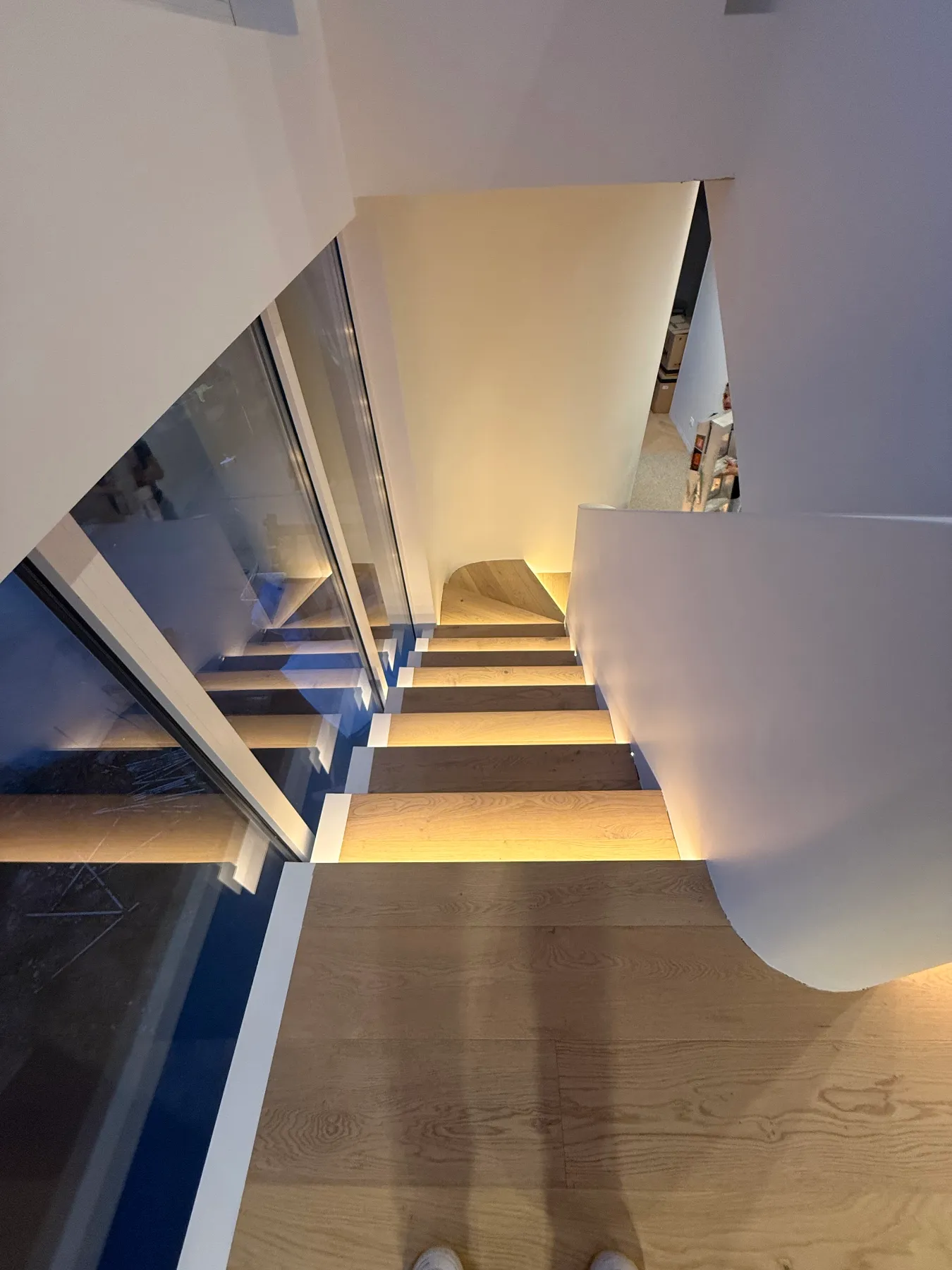 Close view of LED strip lighting under a timber stair tread