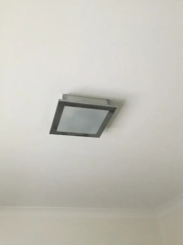 Old ceiling light that had stopped working, before our electrician replaced it with a DC fan in Holland Park West