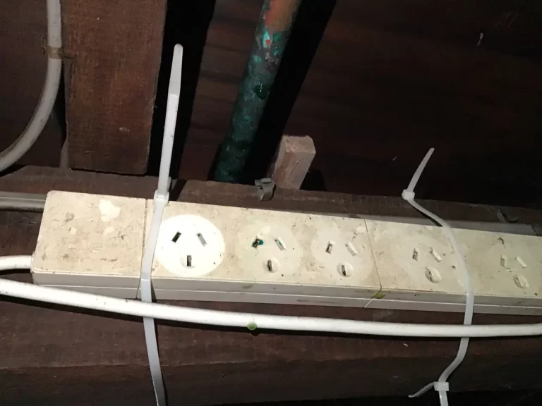 Power board and wiring under an Annerley house, checked during a safety switch tripping fault