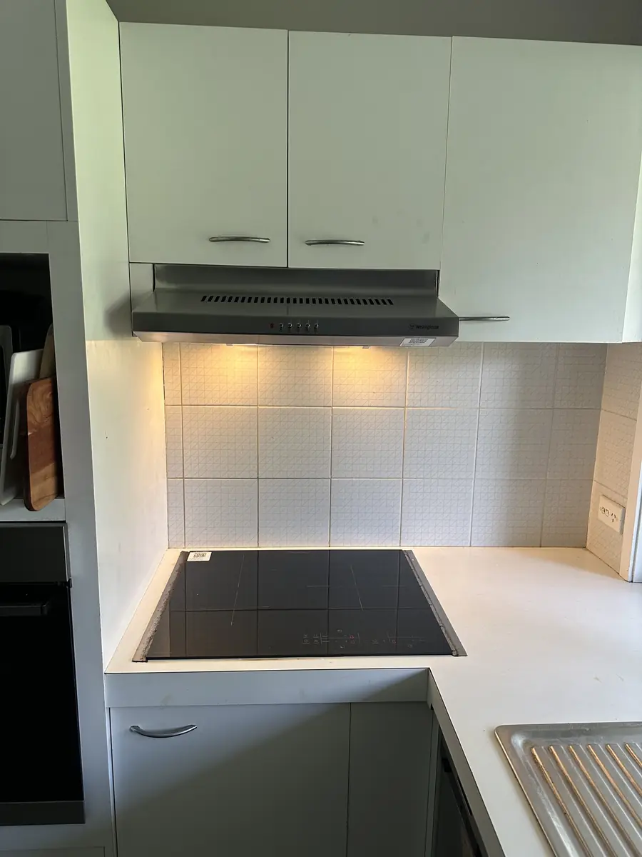New rangehood with lights and a new cooktop installed by an electrician in Carindale