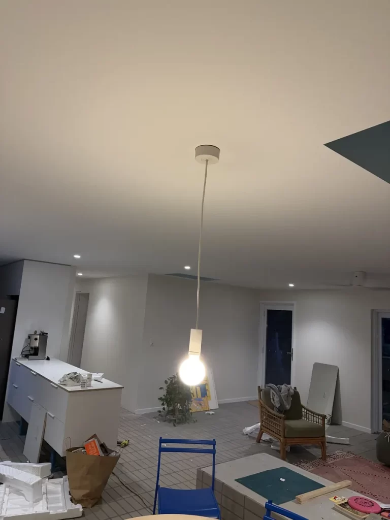 Renovation electrician fit off in The Gap: a pendant light and LED downlights working in the new open-plan living area