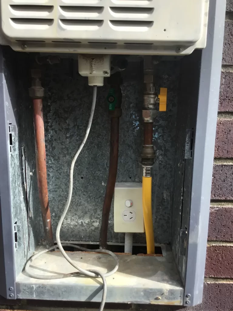Property management electrician job on Brisbane’s southside: the power point inside a hot water cupboard where moisture caused a fault at a Mount Gravatt East rental property
