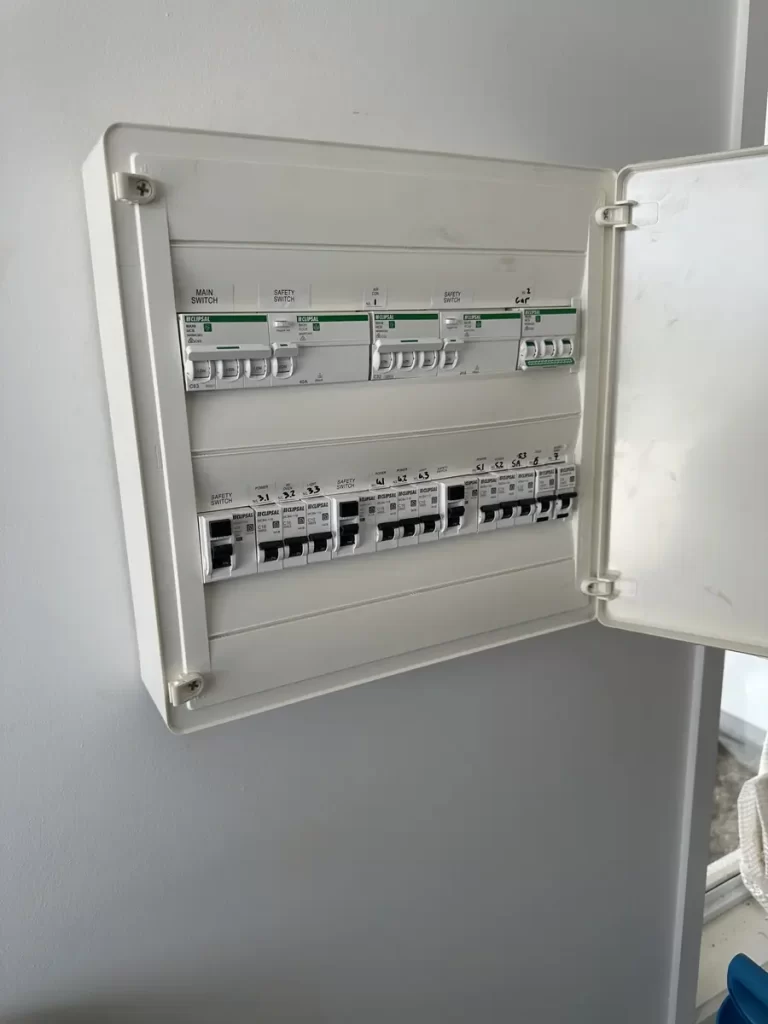 Switchboard opened to trace a tripping lighting circuit in Holland Park West