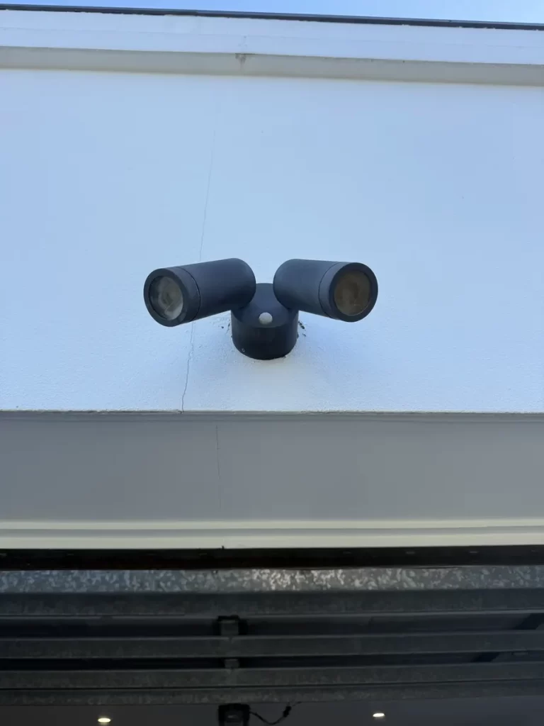 Outdoor lighting in Bulimba: a replacement twin spot sensor light, fitted by a Brisbane southside electrician after water got into the old one