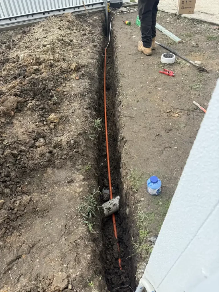 Trench and conduit for new underground gate motor power in Holland Park West